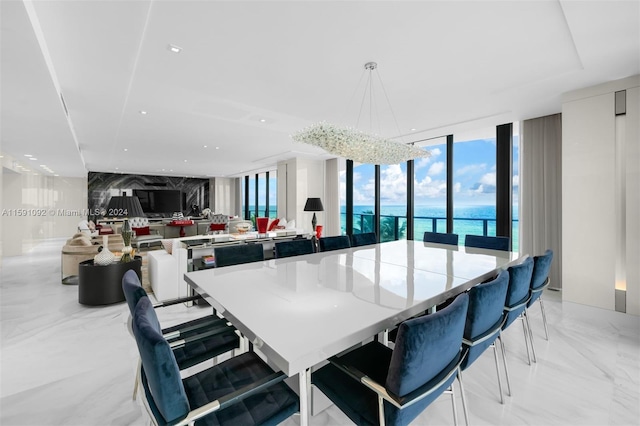 tiled dining area featuring expansive windows