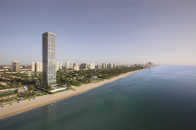 aerial view featuring a water view and a beach view