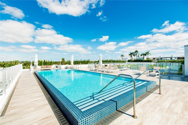 view of swimming pool featuring a patio area