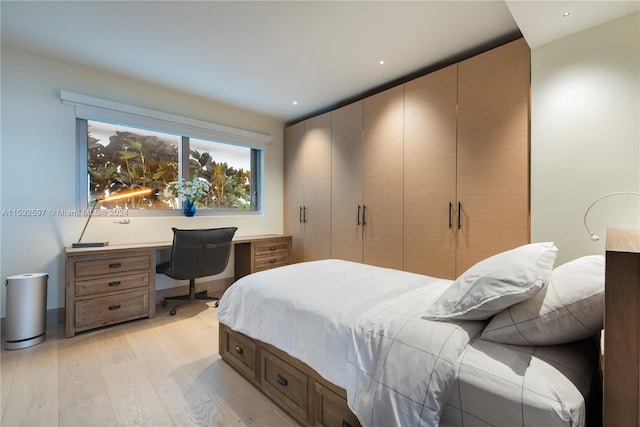 bedroom featuring a closet and light hardwood / wood-style flooring