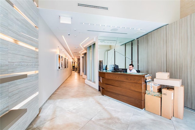 hall with light tile flooring