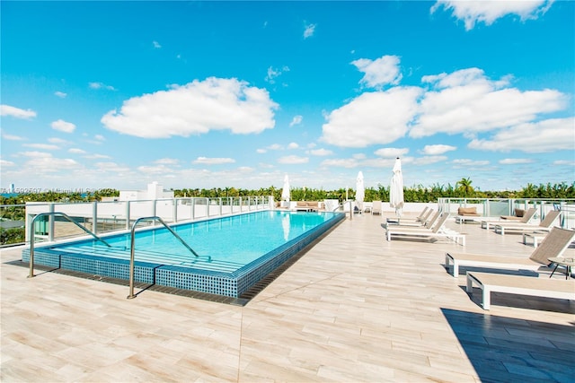 view of swimming pool featuring a patio area