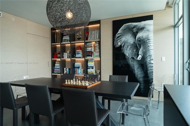 dining space featuring built in shelves