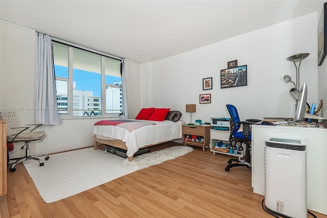 bedroom with light hardwood / wood-style flooring