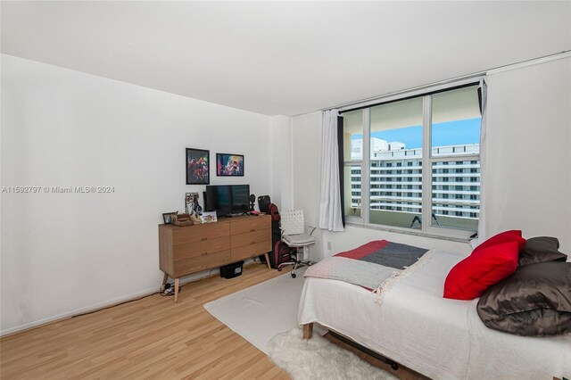 bedroom with hardwood / wood-style floors