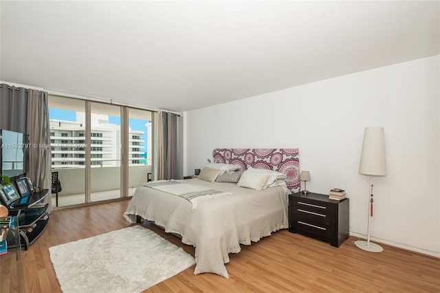 bedroom with wood-type flooring