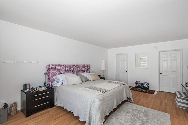 bedroom featuring light wood-type flooring