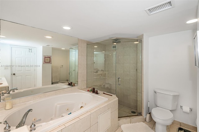 bathroom with tile floors, plus walk in shower, and toilet