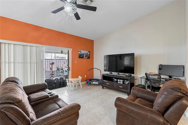 living room featuring a ceiling fan, lofted ceiling, visible vents, and light tile patterned floors