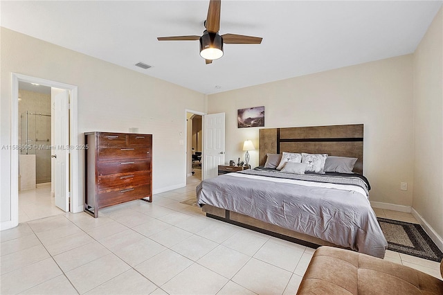 bedroom with visible vents, light tile patterned flooring, connected bathroom, ceiling fan, and baseboards