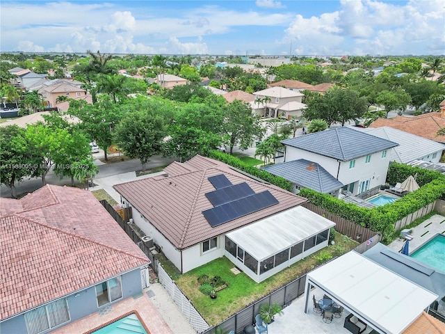 birds eye view of property with a residential view