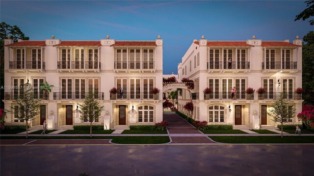 rear view of house with a balcony