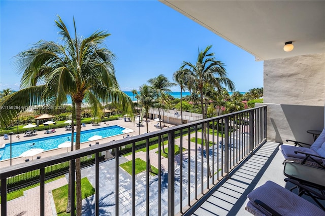 balcony featuring a community pool