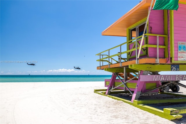 property view of water featuring a beach view