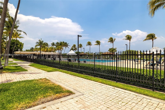 view of nearby features with a swimming pool and a lawn