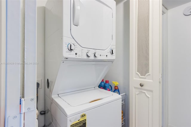 laundry room featuring stacked washer and clothes dryer