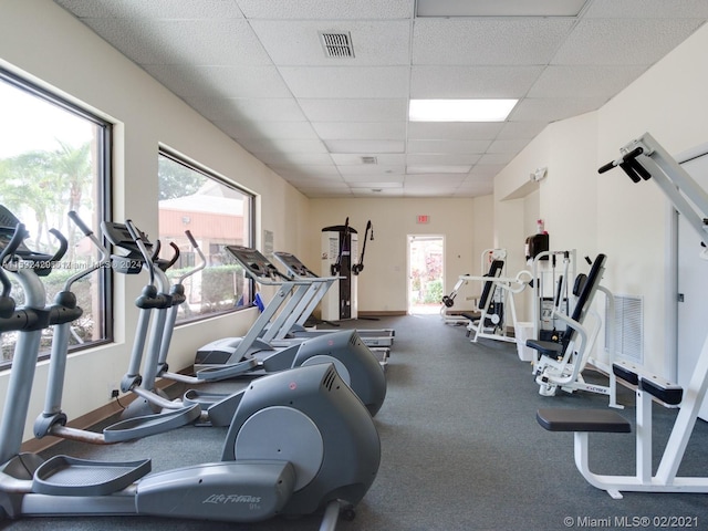 exercise room featuring a paneled ceiling