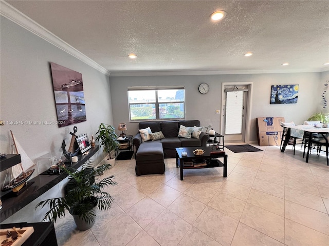 living room with a textured ceiling, crown molding, and light tile patterned floors