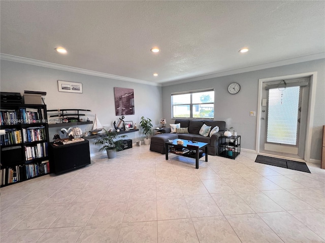 living room with light tile patterned floors, a textured ceiling, and ornamental molding