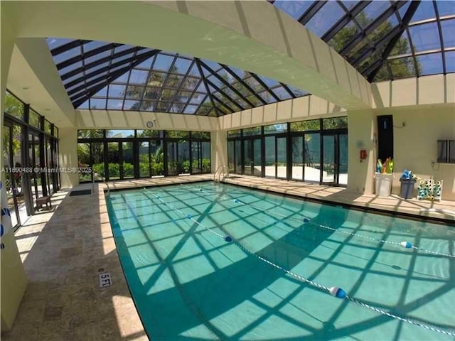 view of swimming pool featuring a lanai