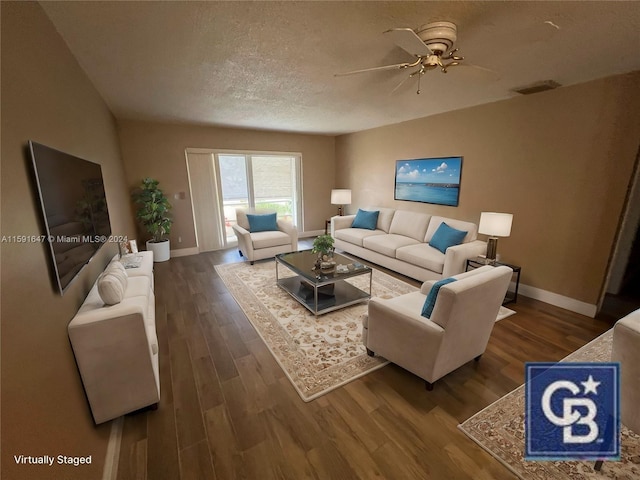 living room with hardwood / wood-style floors, ceiling fan, and a textured ceiling