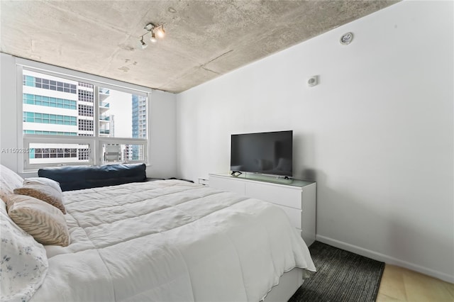 bedroom with hardwood / wood-style floors