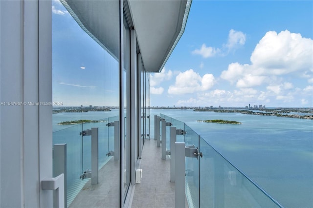 balcony featuring a water view