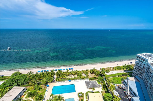 aerial view with a water view and a view of the beach