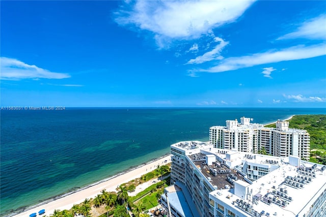 birds eye view of property featuring a view of the beach and a water view