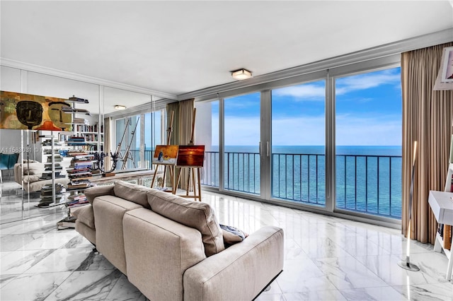 living room with a water view and floor to ceiling windows