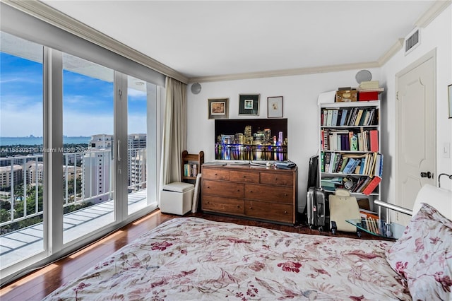 bedroom featuring wood-type flooring, access to outside, and ornamental molding