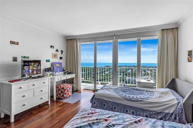 bedroom with access to outside, multiple windows, crown molding, and dark hardwood / wood-style flooring