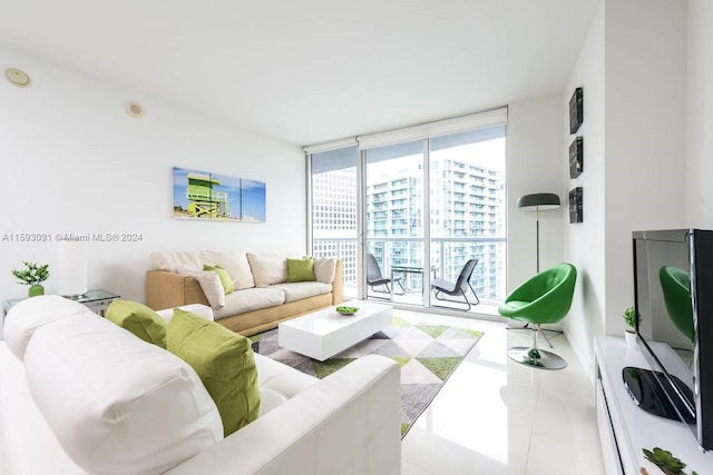 living room with expansive windows and tile floors