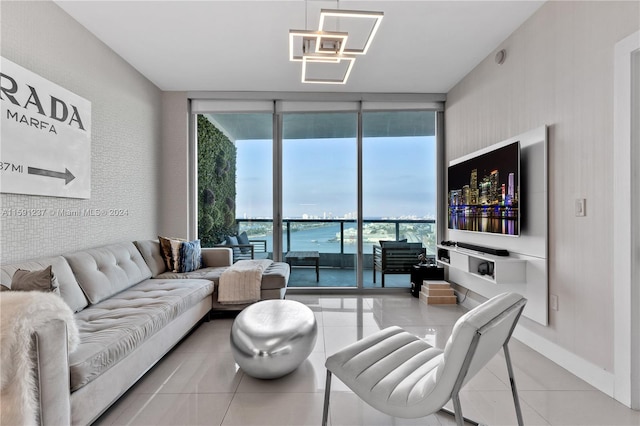 tiled living room with a wall of windows and a water view