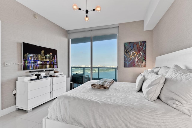 tiled bedroom featuring access to outside, floor to ceiling windows, and a water view