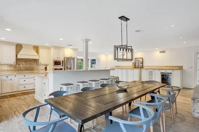 dining area featuring light wood-type flooring