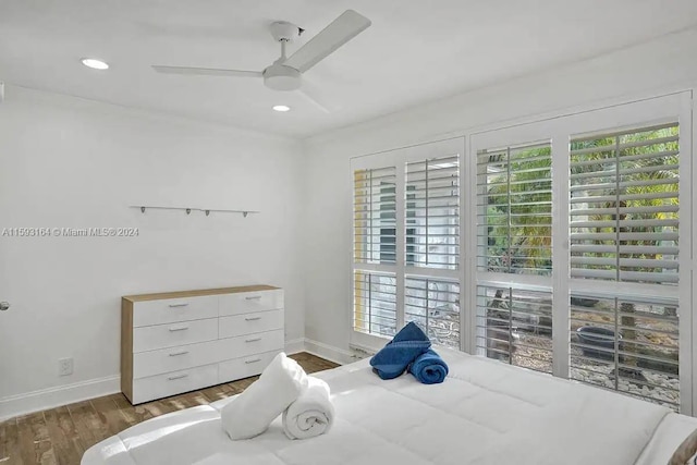 bedroom featuring wood-type flooring and ceiling fan