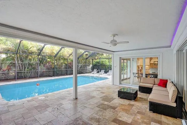 view of pool featuring ceiling fan, outdoor lounge area, glass enclosure, and a patio