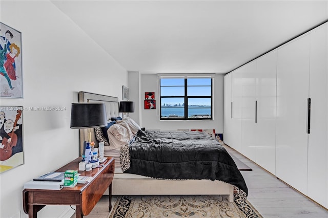 bedroom with light hardwood / wood-style floors