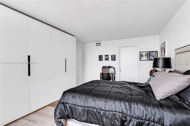 bedroom featuring light wood-type flooring