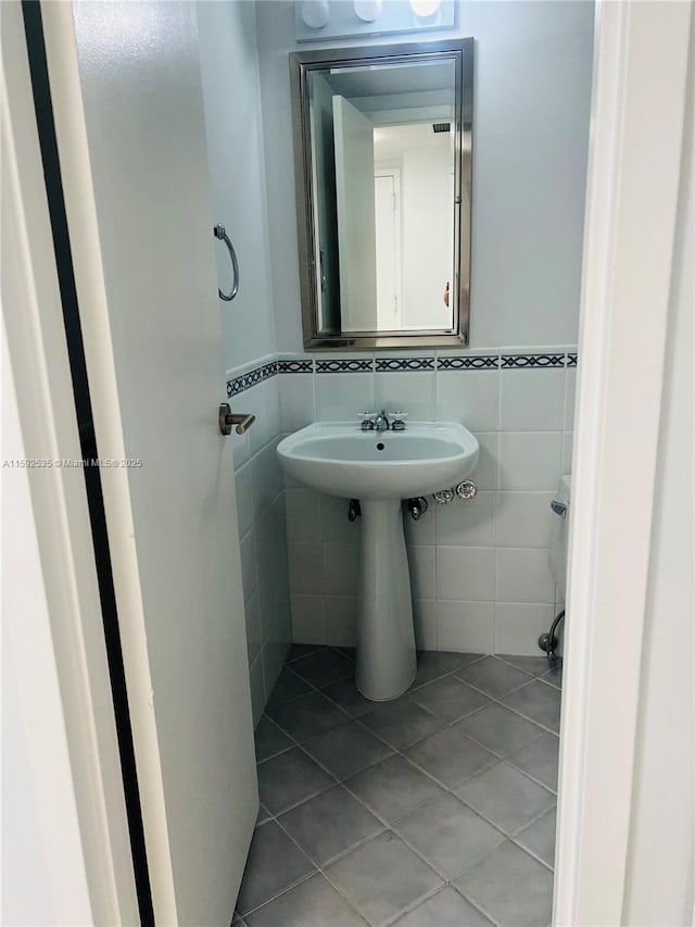 bathroom featuring tile walls and tile patterned floors