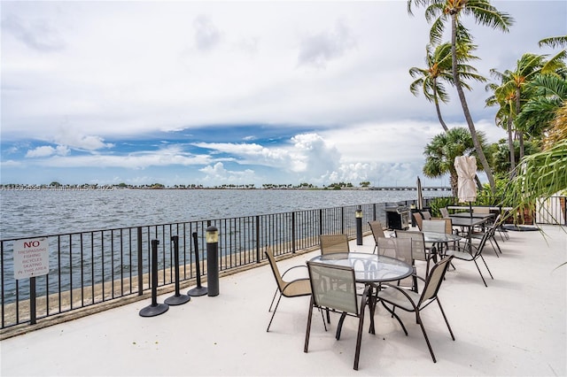 view of patio with a water view