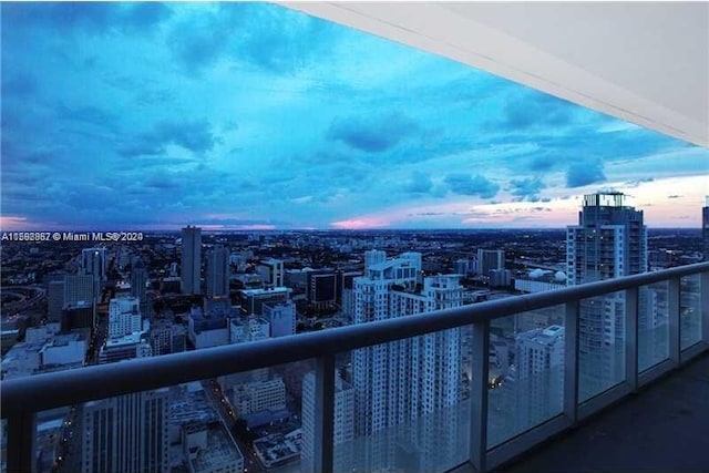 view of balcony at dusk