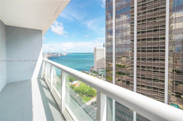 balcony featuring a water view