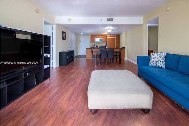 living room with dark hardwood / wood-style floors