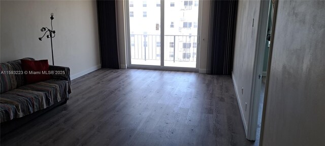 sitting room with wood-type flooring and ceiling fan