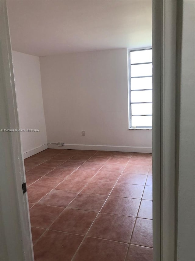 empty room with tile flooring