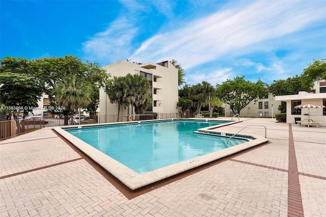 view of swimming pool featuring a patio area