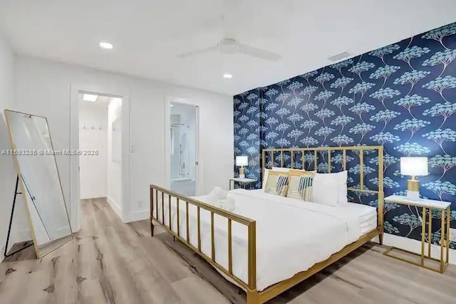 bedroom with wood-type flooring and ceiling fan