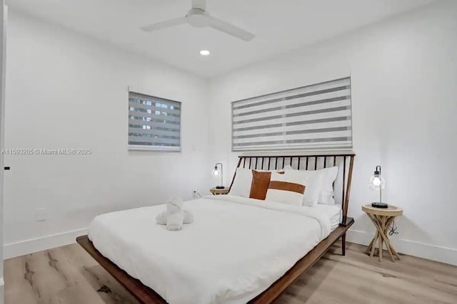 bedroom featuring ceiling fan and light wood-type flooring